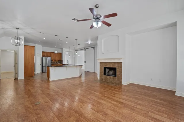 a view of a kitchen with a sink and a fireplace
