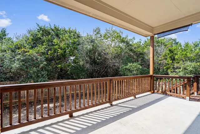 a view of a two chairs in the balcony