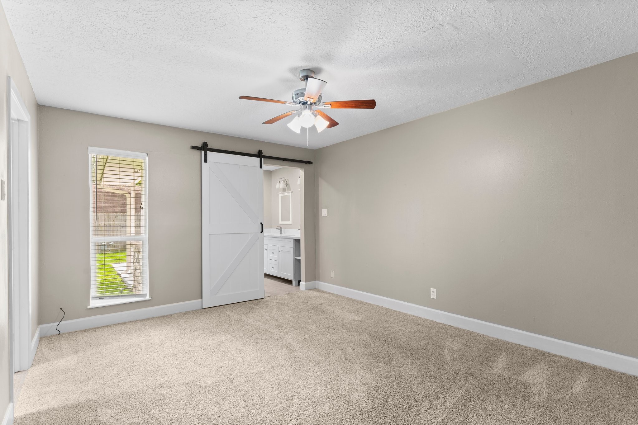 27234 Wells Lane Conroe, TX 77385 - Photo 10 of 15 an empty room with fan and windows