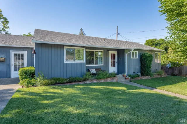 a view of a house with a yard