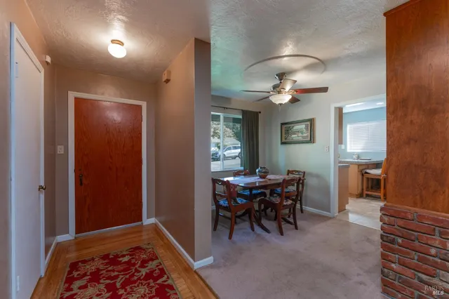 a view of a livingroom with furniture and a window