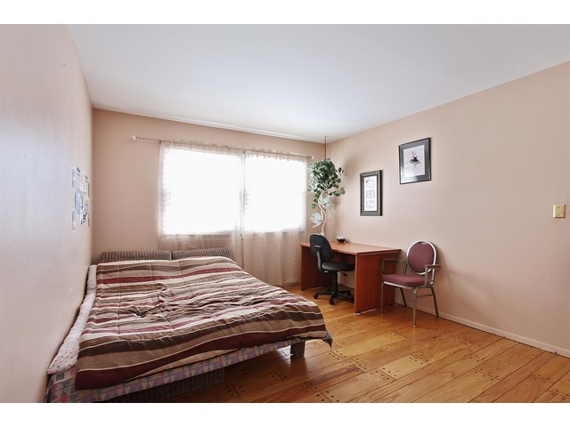 560 Weidner Road Buffalo Grove, IL 60089 - Photo 8 of 10 a bedroom with a bed and a chair