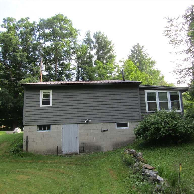 412 Sylvester Road Northampton, MA 01062 - Photo 4 of 18 front view of a house with a yard