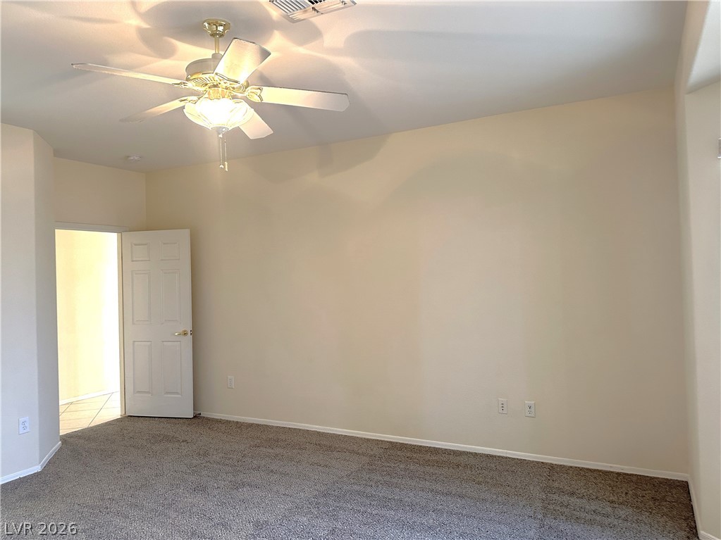3034 Canal Walk Road Henderson, NV 89052 - Photo 11 of 24 This spacious bedroom offers ample space for comfort and relaxation.