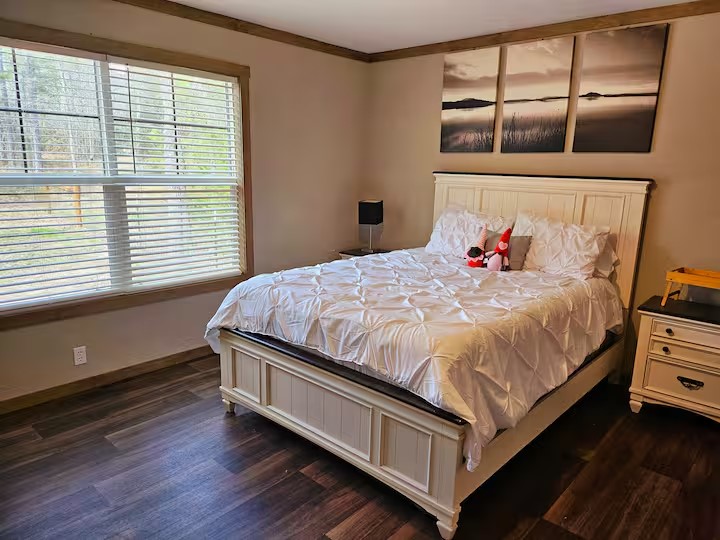 105 Saddle Surrey Road Coldspring, TX 77331 - Photo 26 of 48 a bedroom with a bed and window