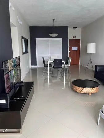 a kitchen with a table and chairs in it