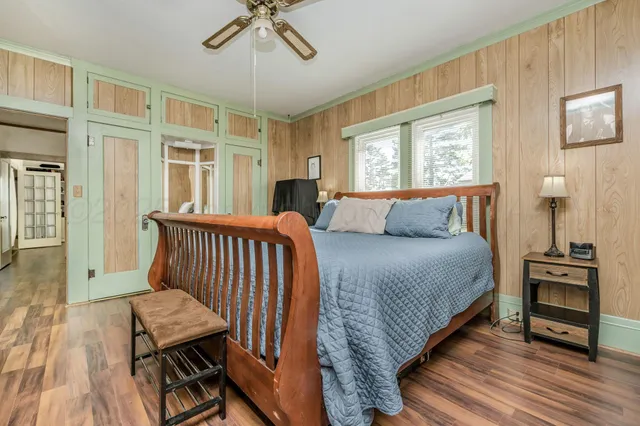 a bathroom with a sink a toilet and shower curtain