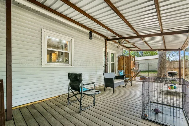 a view of a backyard with a tree