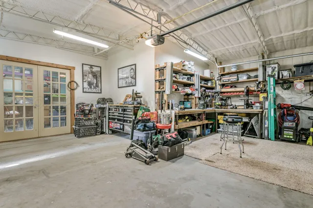 a bedroom with furniture and a flat screen tv