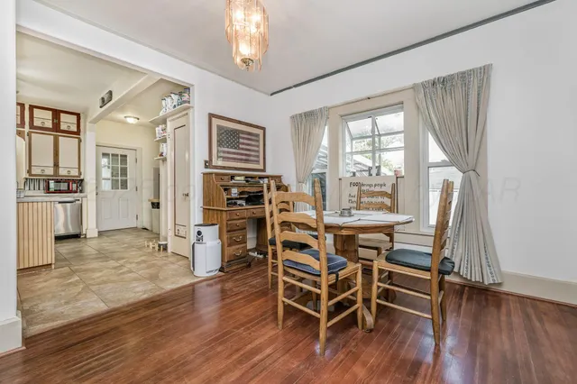 a kitchen with a stove a sink and a refrigerator