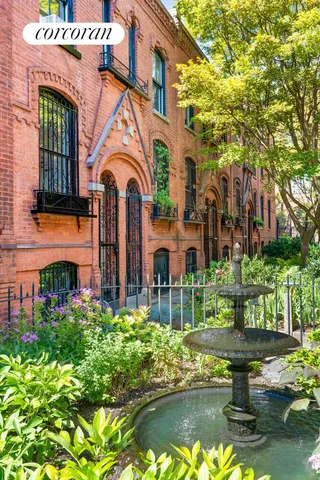 a view of a brick building with many windows