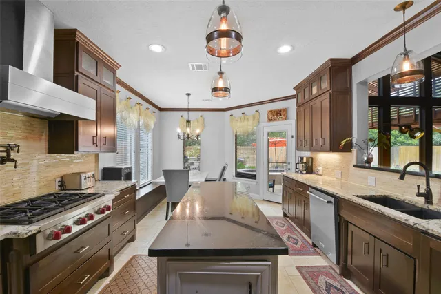 a kitchen with a stove and a sink