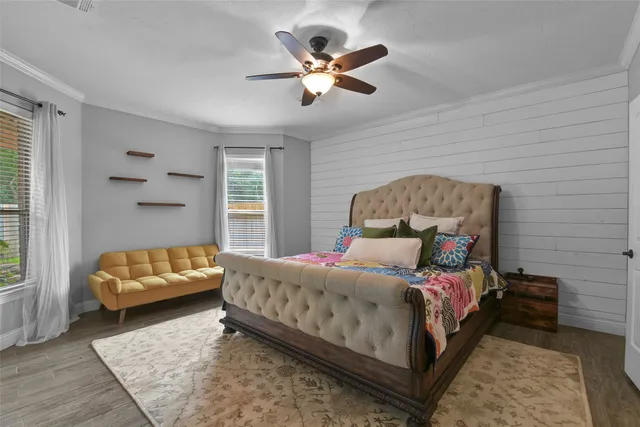 a bedroom with a bed and window