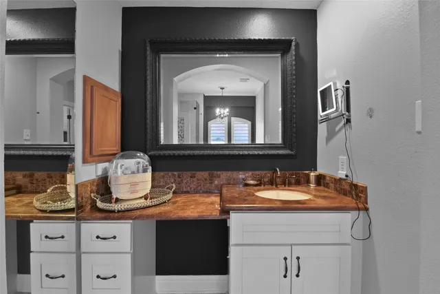 a bathroom with a sink and a mirror