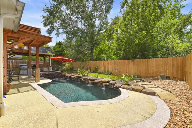 swimming pool view with a seating space