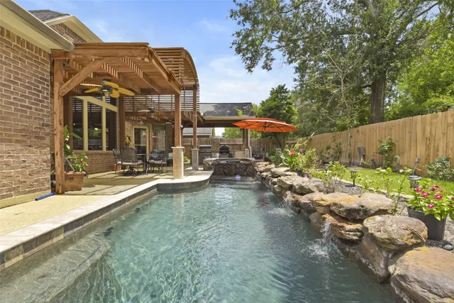 a view of a swimming pool with a patio