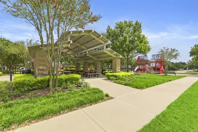 a view of a lake with houses in the background