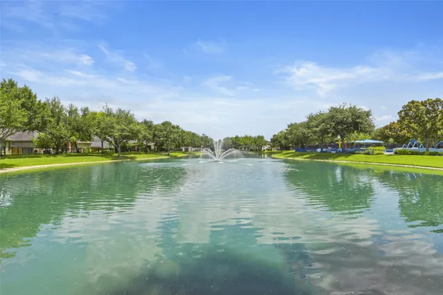 a view of a park with slide and table