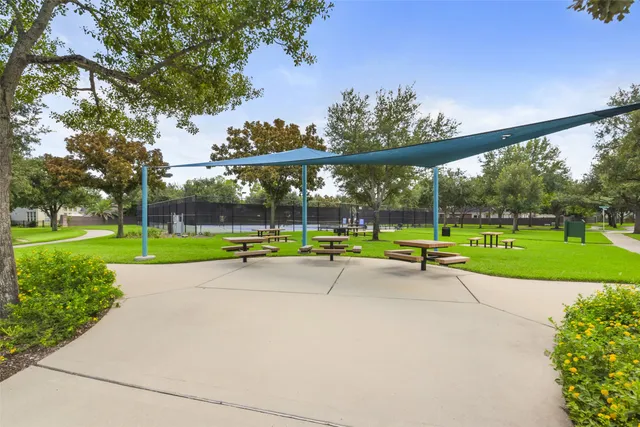 a view of outdoor space with playground and green space