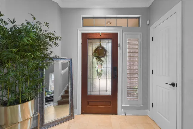 a view of front door and bedroom