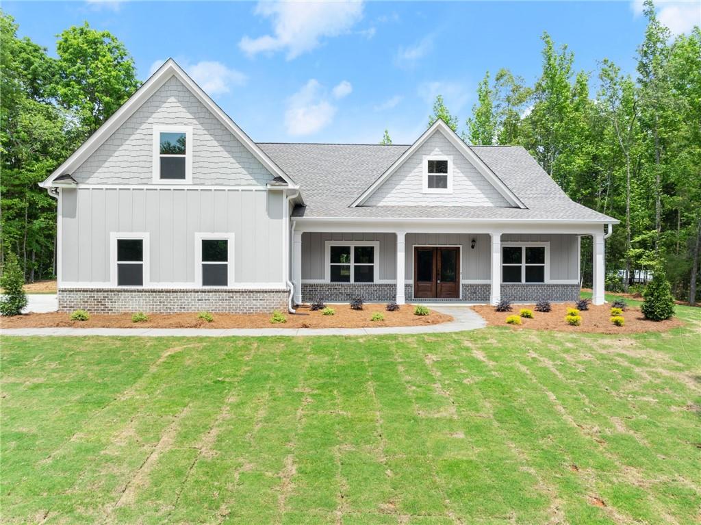 525 Christmas Tree Road Homer, GA 30547 - Photo 1 of 1 a front view of house with yard and green space