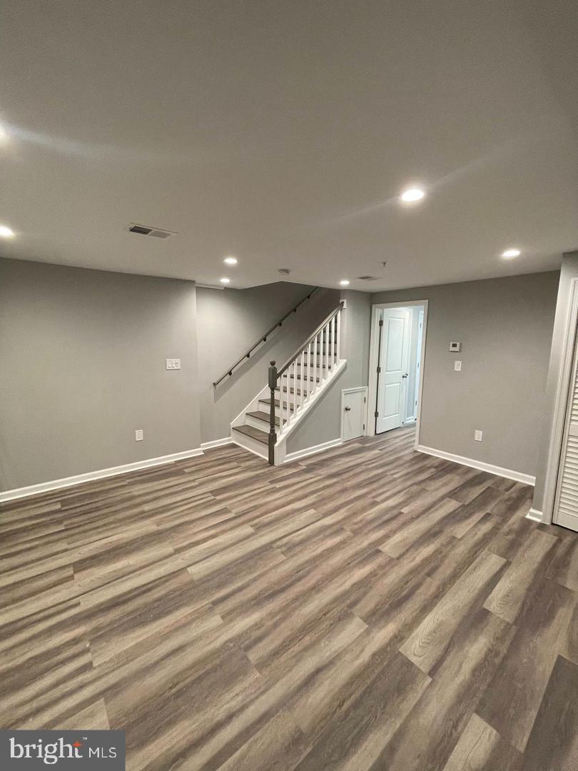 620 20th Street Northeast, Unit B Washington, DC 20002 - Photo 5 of 18 an empty room with wooden floor and windows