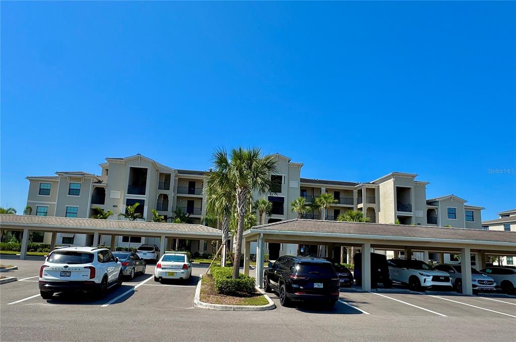 18028 Gawthrop Drive, Unit 303 Bradenton, FL 34211 - Photo 2 of 58 a car parked in front of building