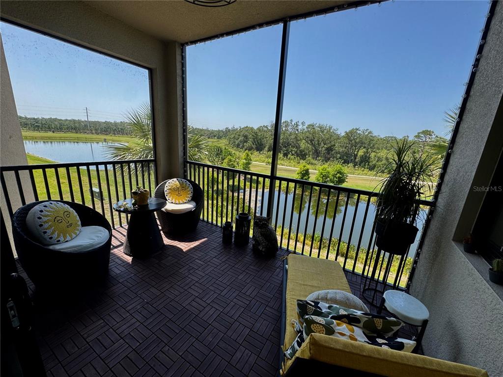 18028 Gawthrop Drive, Unit 303 Bradenton, FL 34211 - Photo 22 of 58 a balcony with chairs