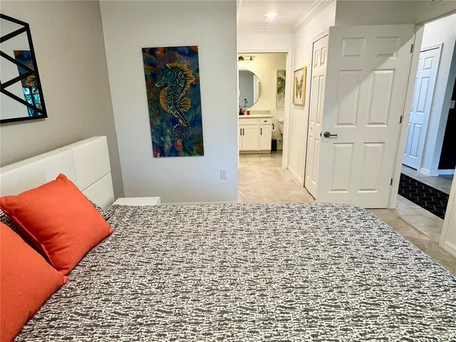 a bedroom with a bed and a rug
