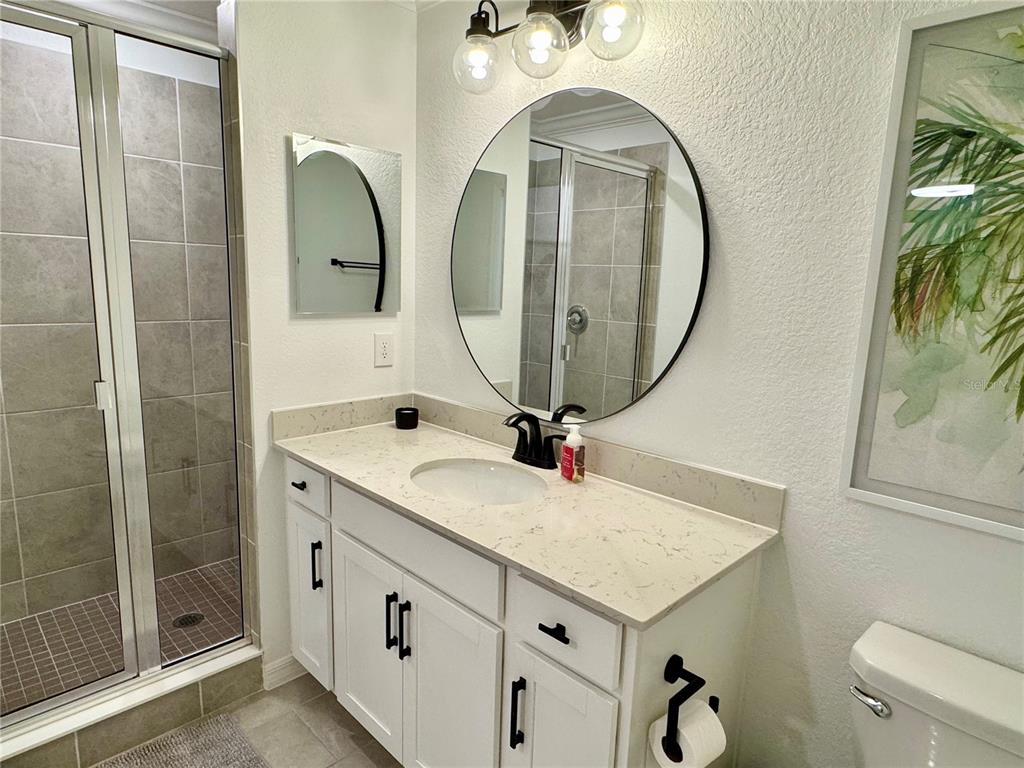18028 Gawthrop Drive, Unit 303 Bradenton, FL 34211 - Photo 27 of 58 a bathroom with a sink a vanity and a mirror