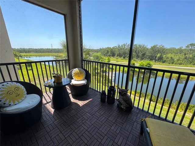 a view of a chair and tables in the roof deck