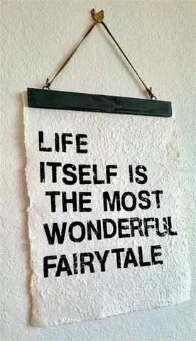 a black and white checkered curtain with lots of white walls