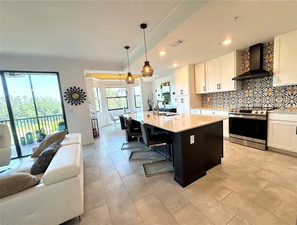 a kitchen with a cabinets counter top space appliances and windows