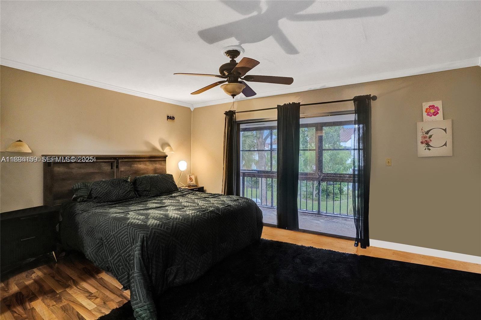 6483 Racquet Club Drive, Unit 22 Lauderhill, FL 33319 - Photo 12 of 24 a bedroom with a bed and a window