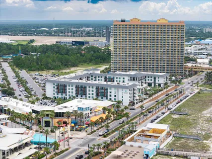 a living room with a couch and a table with wooden floor