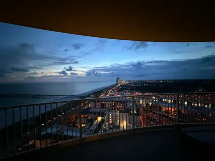 a view of a lake with houses in the back