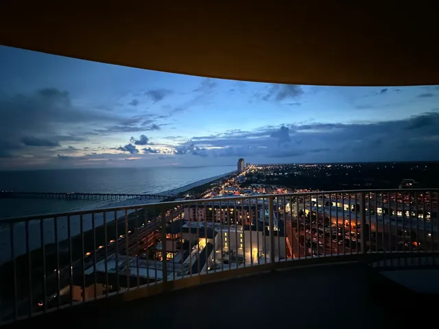 a view of a lake with houses in the back