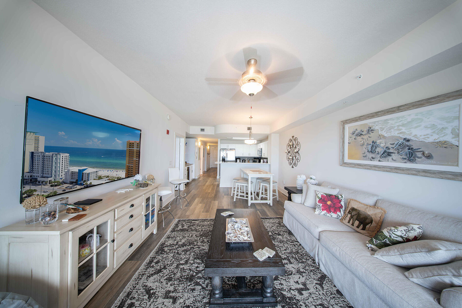 15928 Front Beach Road, Unit 32011 Panama City Beach, FL 32413 - Photo 31 of 84 a living room with furniture and a flat screen tv