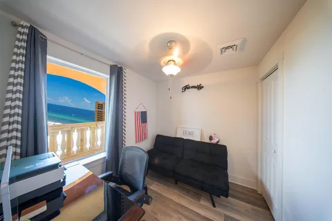 a view of store with a outdoor seating