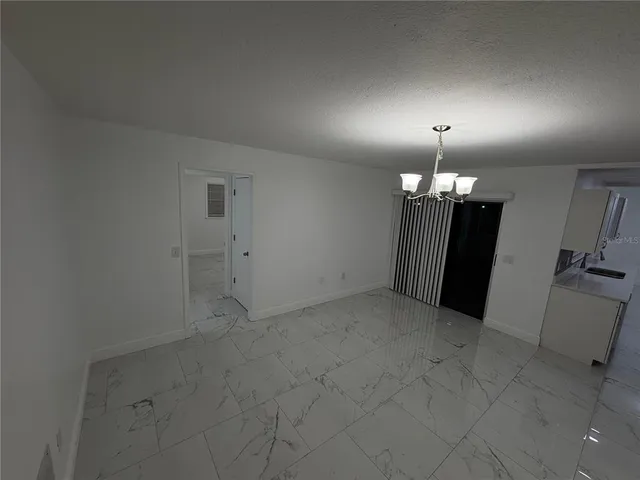 a bathroom with a sink a toilet a mirror and shower