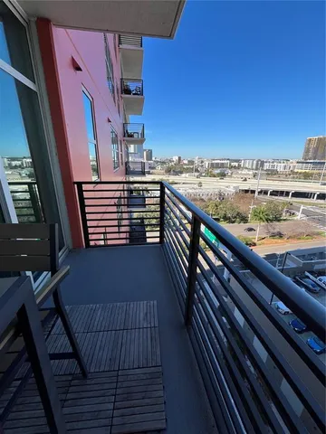 a view of balcony with wooden floor