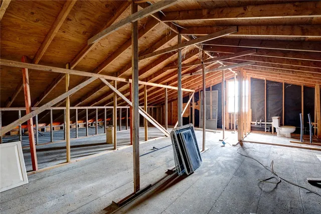a view of an empty room with stairs
