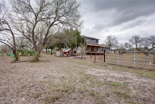 a view of outdoor space with deck and kitchen