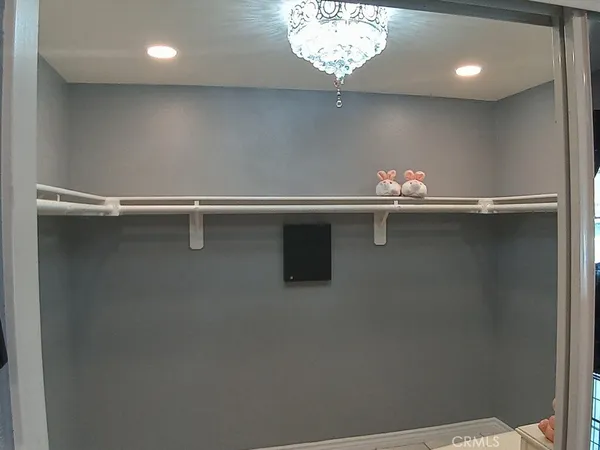 an empty room with a chandelier