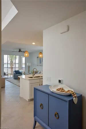 a kitchen with a sink cabinets and window