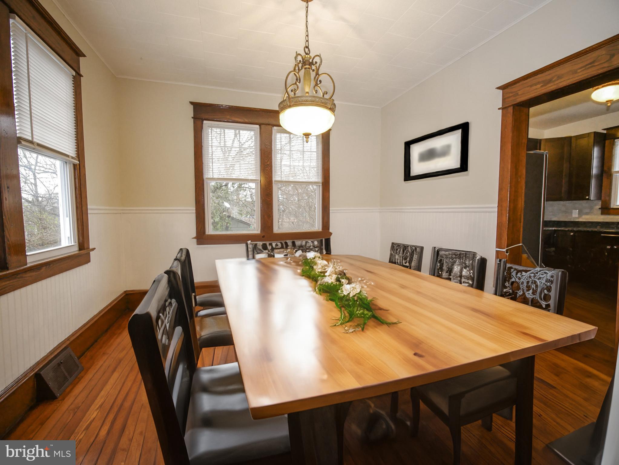 332 Crown Point Road Thorofare, NJ 08086 - Photo 13 of 36 a view of a dining room with furniture window and wooden floor