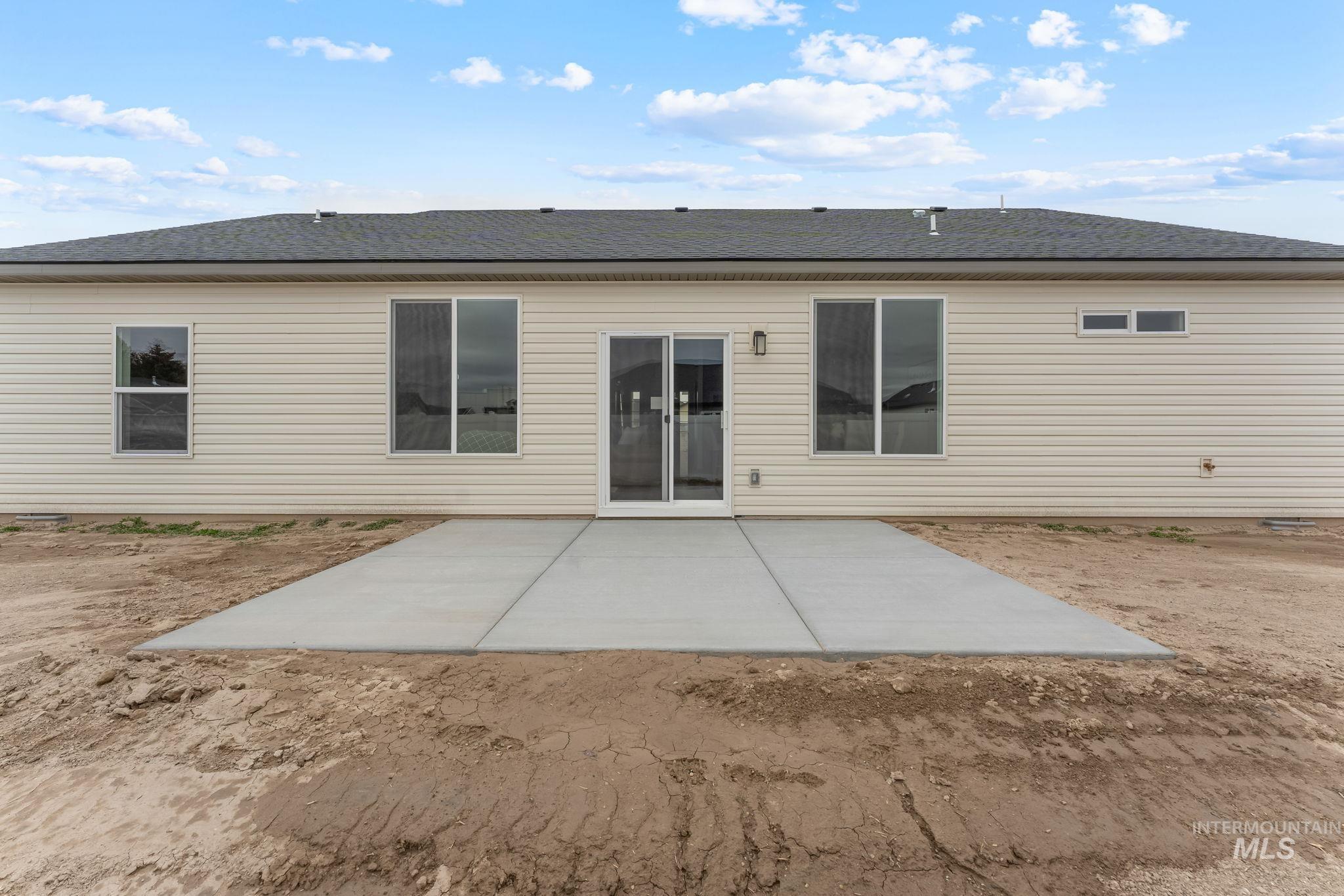 2220 Great Basin Way Burley, ID 83318 - Photo 35 of 39 Back of house featuring a patio area and roof with shingles