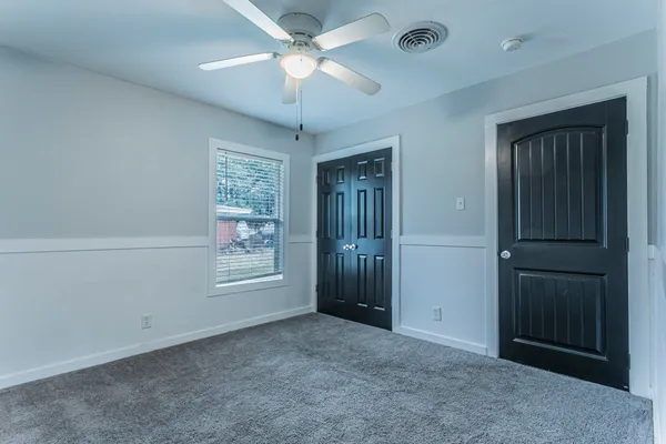 a view of an empty room with a window