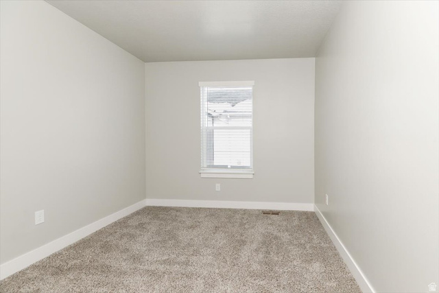 226 South 600 West Logan, UT 84321 - Photo 13 of 25 Spare room with light carpet and baseboards