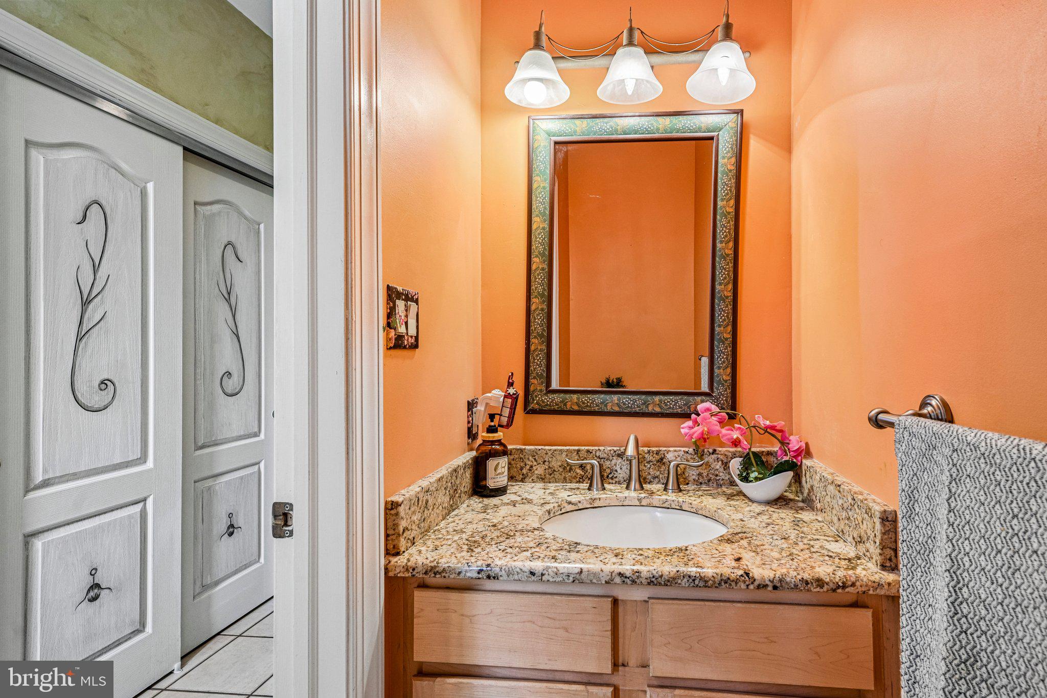 434 Meetinghouse Road Ambler, PA 19002 - Photo 20 of 51 a bathroom with a granite countertop sink and a mirror